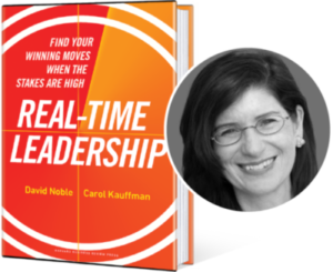 A photo of Carol Kauffman, PhD with her book "Real-time Leadership"